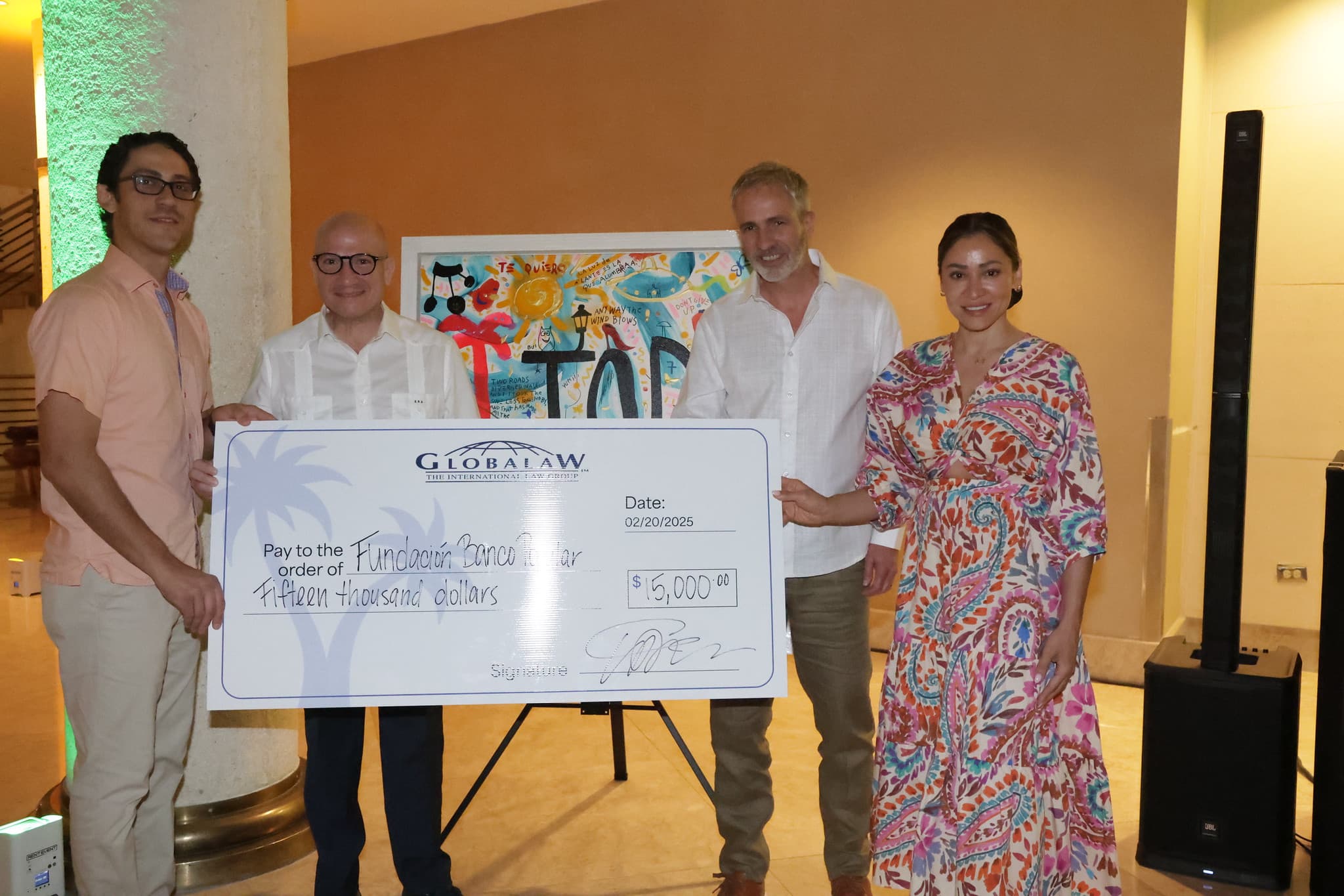 Group holding a big check