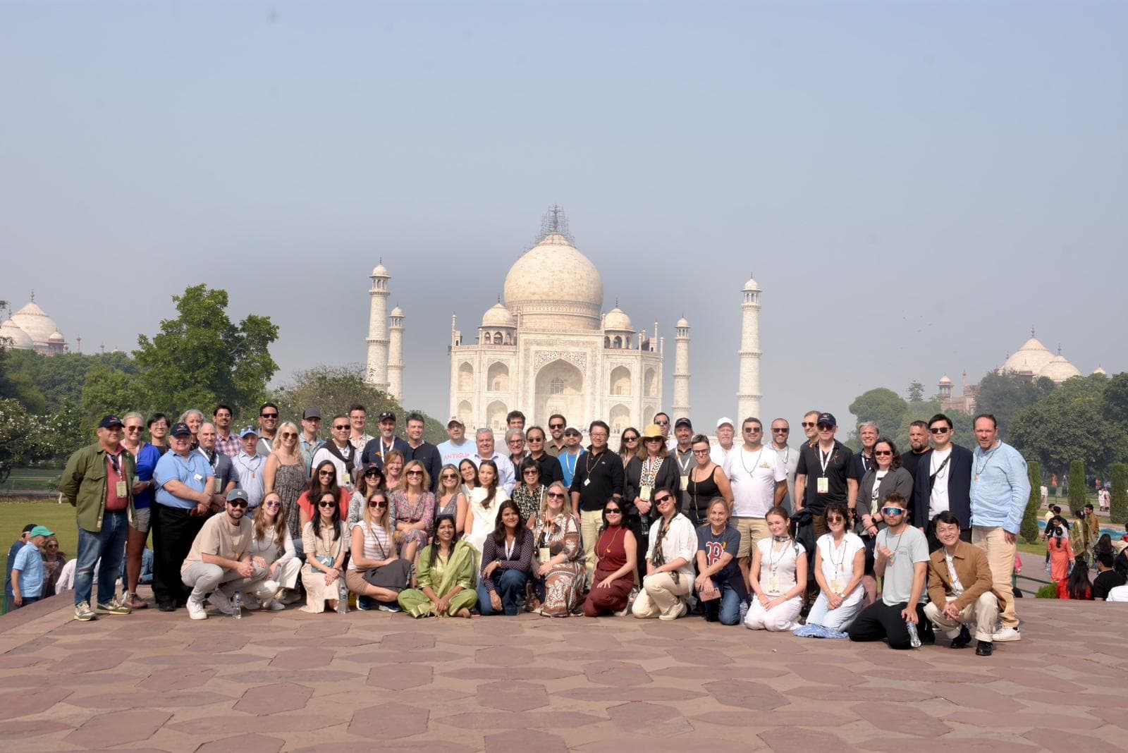 group of people in front of the taj mahal